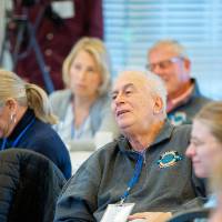 crowd members listening